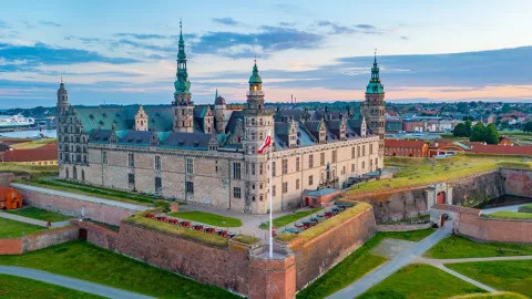 A landscape view of the grand Kronborg Castle in Helsingør, Denmark.