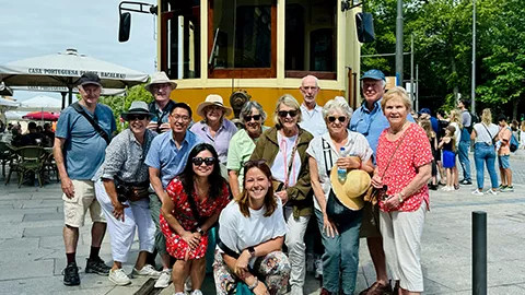 Guests posing for a photo on their Iberian Inspiration tour in Lisbon.
