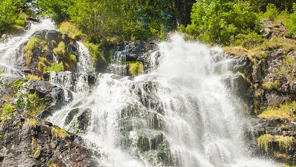 Water courses down a waterfall in the iconic Black Forest in Germany.