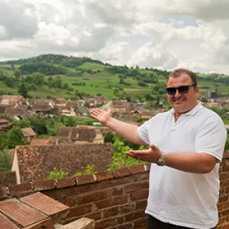 Tour Leader sharing his home country with guests.