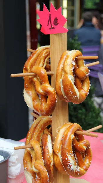 Pretzels hanging off a stand in a German Market.