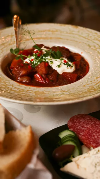 A plate of Borscht served on a table.
