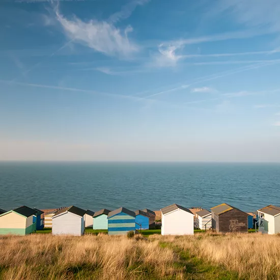 Small colourful cottages line the coast of Whitstable.