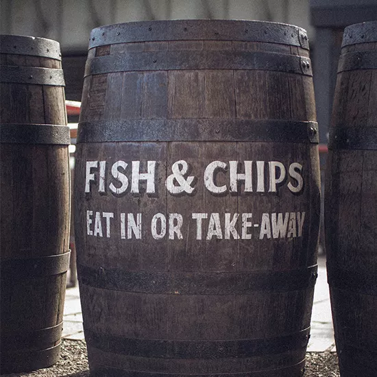 A picture of a barrel labelled "Fish & Chips Eat-in or Takeaway".