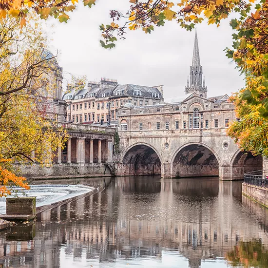 A flowing canal in the city of Bath.