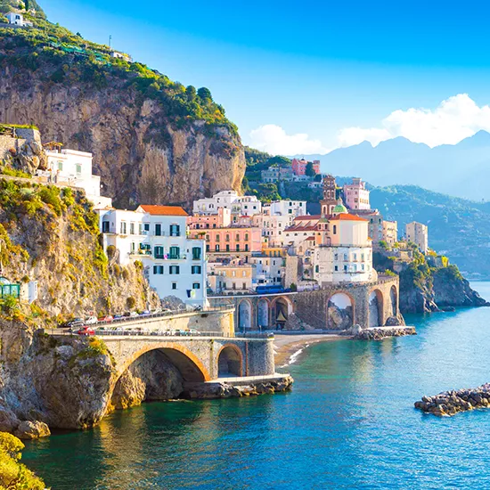 A view of the iconic Amalfi Coast, a scenic destination dotted with sheer cliffs and grand villas.