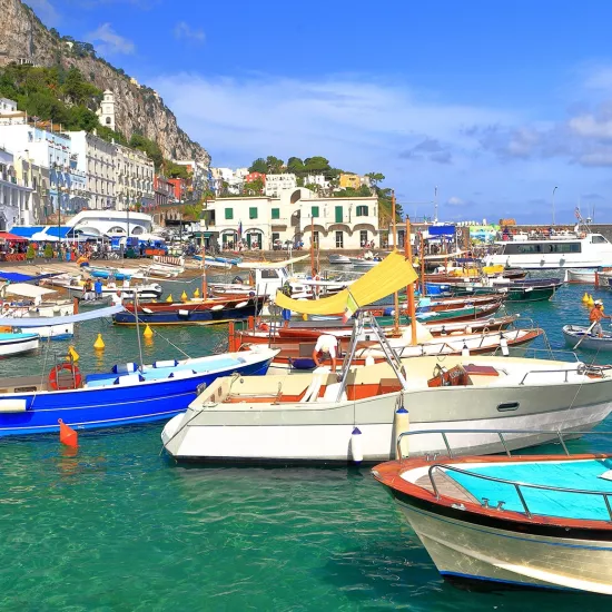 Boats line the coastal waters of the Port of Marina Grande on the Island of Capri.