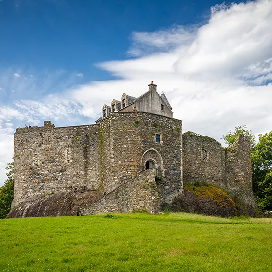 A view of Dustaffnage Castle and Chapel, an old ruined stronghold in the Western Highlands.