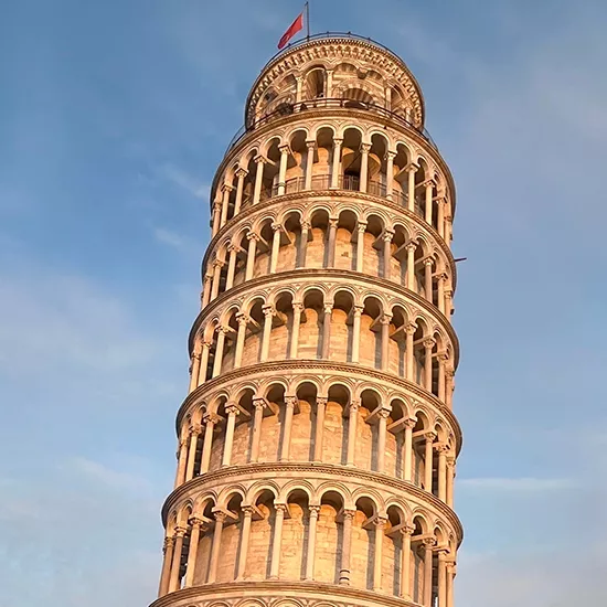 A view of the iconic Leaning Tower of Pisa during dusk.
