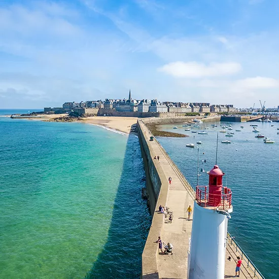 A view over St Malo, the walled city of Brittany, with the lighthouse in the foreground.